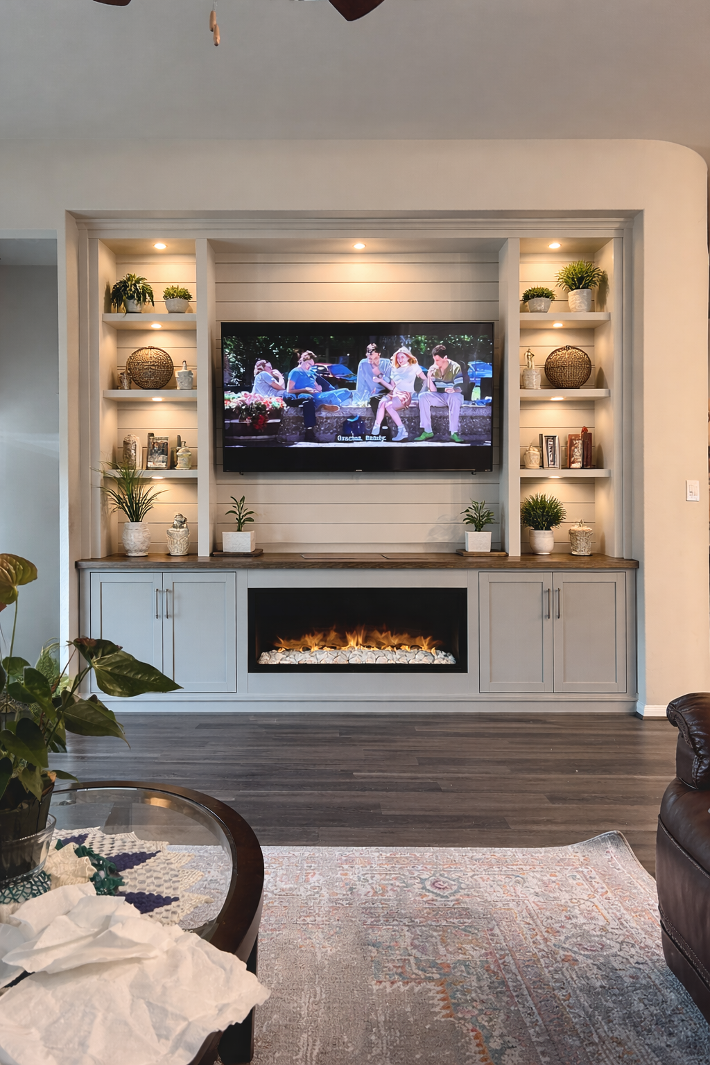 Custom media wall by Elite Accent Wall with fireplace, cabinetry and shelving
